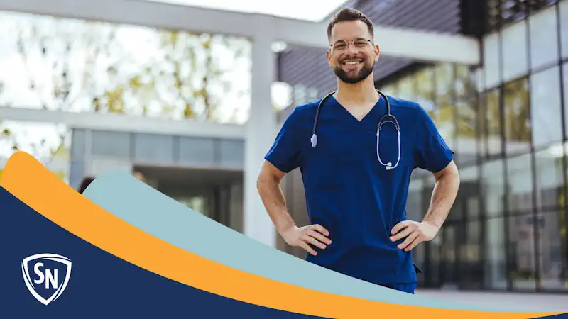 male medical assistant in front of hospital, smiling