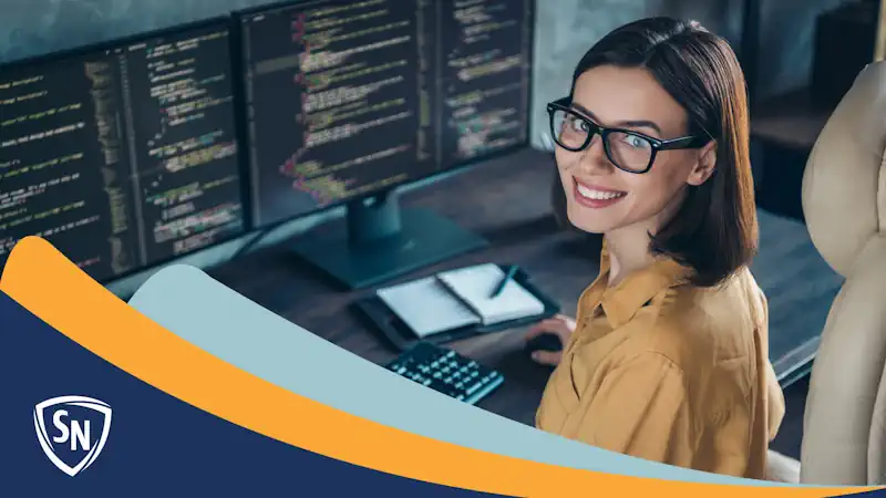 woman analyzing code, smiling