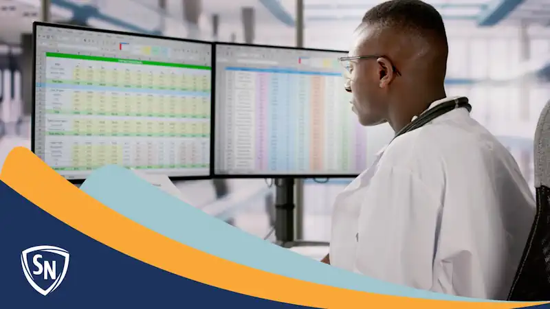 medical biller working at a computer
