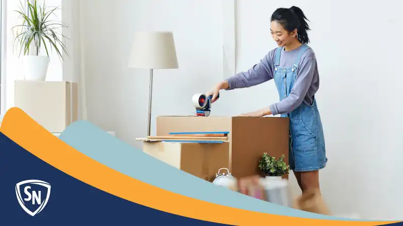 happy girl packing apartment